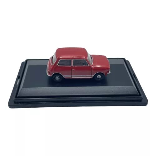 Red classic Mini Cooper diecast car model on black display base