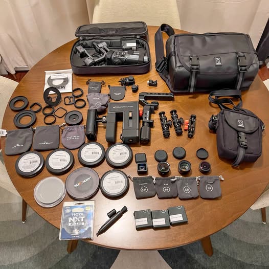 Drone and mobile photography gear kit with cases, batteries, lenses, and accessories