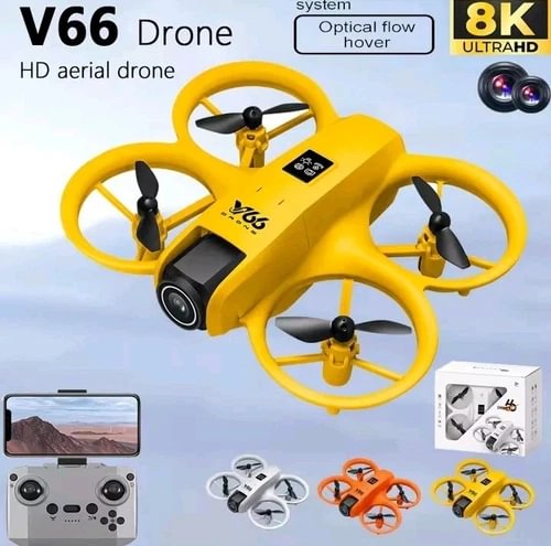 Yellow mini quadcopter drone with built-in camera and four foldable propellers