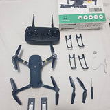 Quadcopter drone kit with remote, propellers, clips, and USB cable