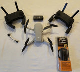 Camera drone quadcopter with three propeller arms and spare Li-ion battery pack