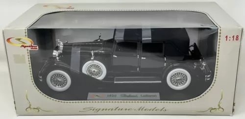 1:18 diecast car model in box, black 1930 Packard LeBaron with chrome wheels.