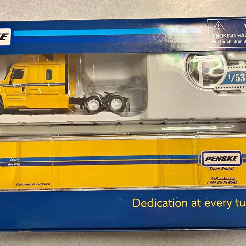 Yellow and gray Penske diecast tractor-trailer replica model, side view with logos