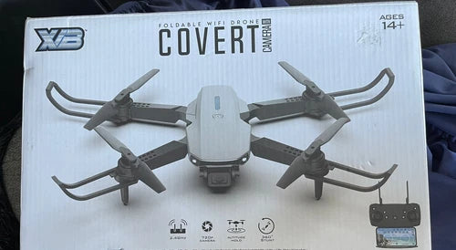 Foldable WiFi camera drone on box, XIB branding, four propellers visible.