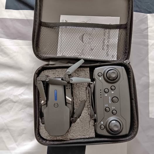 Smart drone kit with remote controller in zippered travel case