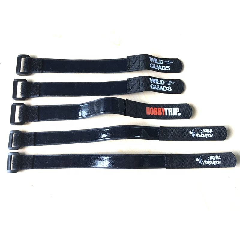 Black rubber battery strap set with plastic buckles and printed drone logos