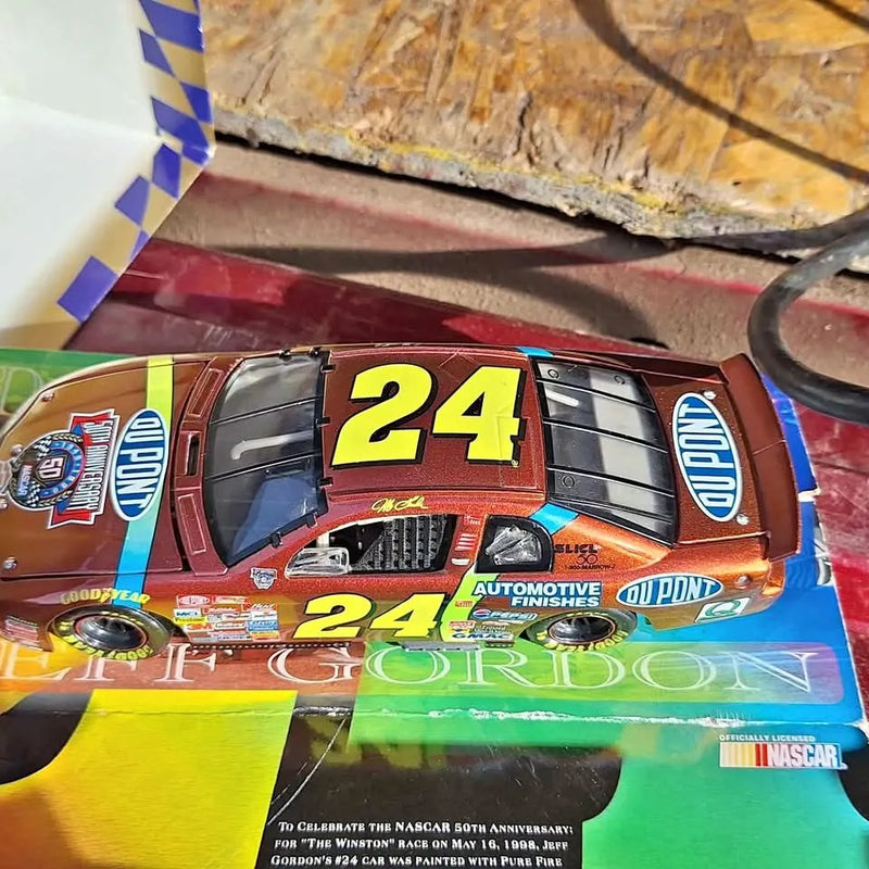 Jeff gordan diecast race car model with red and blue #24 livery and Dupont logo