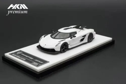 1:64 scale metal die-cast sports car model, white with black accents on display base