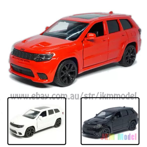 Orange SUV diecast model car with front grille and headlights, 3/4 view, black wheels