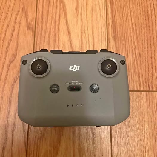 DJI drone remote controller with dual joysticks and central control buttons