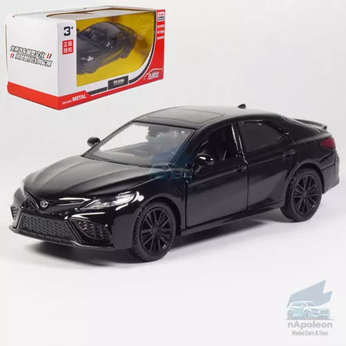 Black diecast model car sedan with detailed front grille and alloy wheels