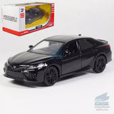Black diecast model car sedan with detailed front grille and alloy wheels