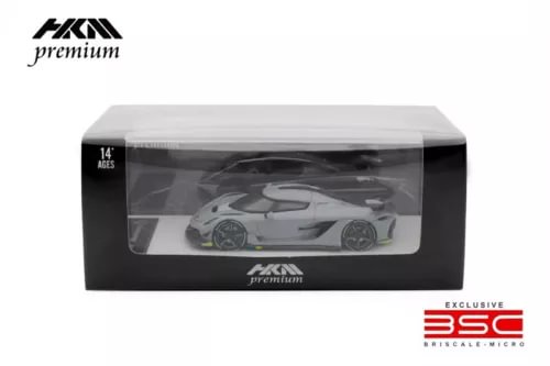 Light grey diecast model car in display box, 1:64 scale