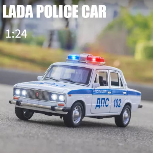 1:24 scale diecast police car with light bar, blue and white, front view