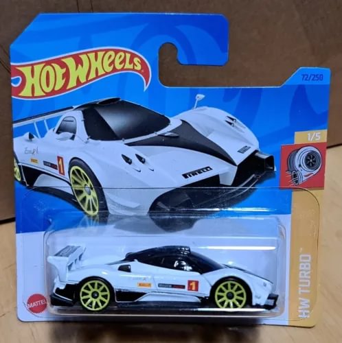 White and black diecast sports car in Hot Wheels blister pack, front view