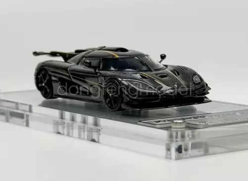 1:64 scale black racing sports diecast car model with detailed carbon-look body