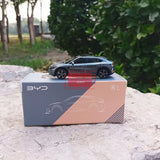 Gray diecast sedan model car on its box with BYD logo and L markings