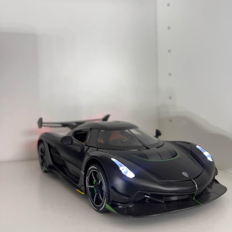 Black diecast sports car model with green accents, front splitter and detailed headlights