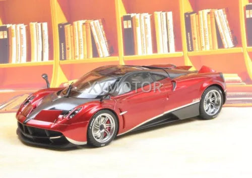 Red and black diecast supercar model with silver wheels and front headlights
