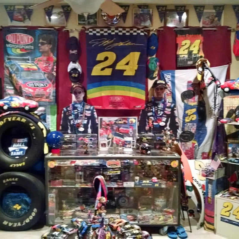 Sports memorabilia display case with diecast trading cards and collectibles, multicolor