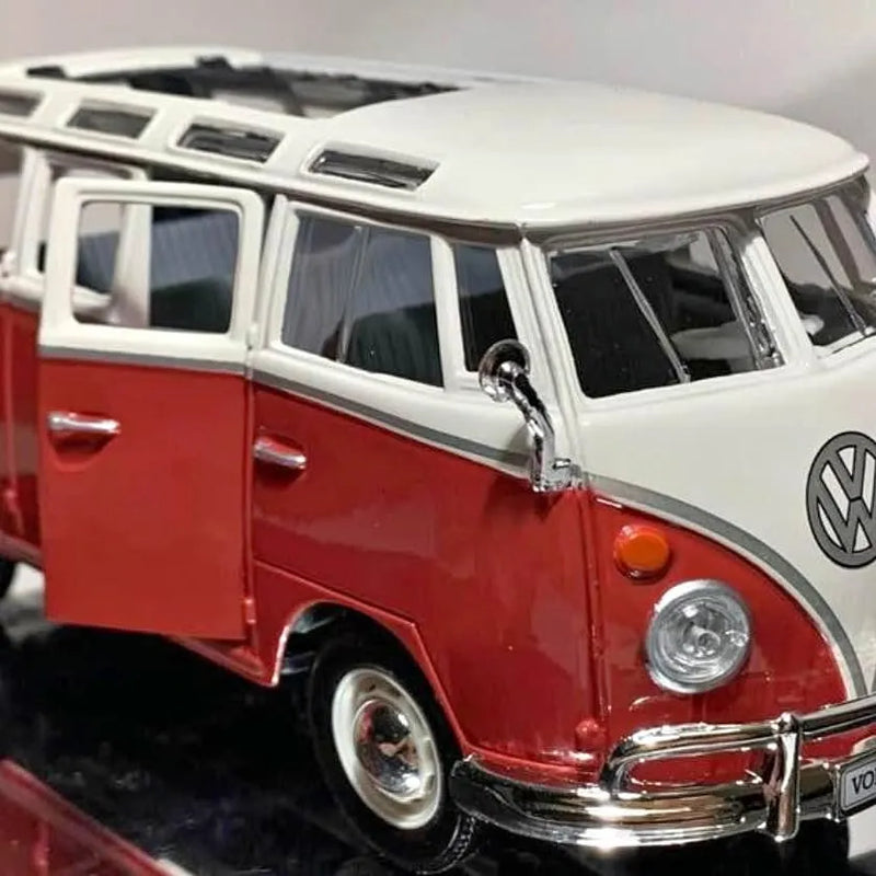 Red and white die-cast Volkswagen Samba van with chrome bumper and VW logo