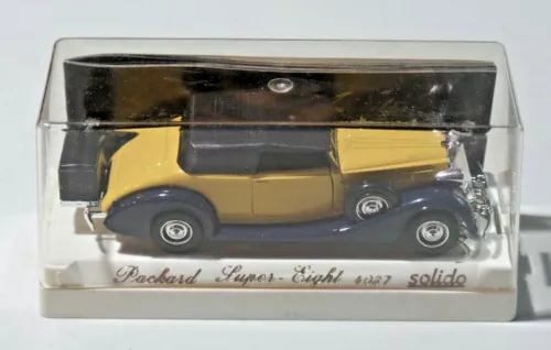 Packard Super Eight diecast model in clear case, gold/yellow