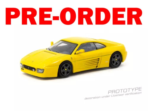 Yellow diecast race car model with black wheels and cockpit windows