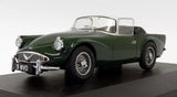 Dark green classic racing coupe diecast model, front three-quarter view