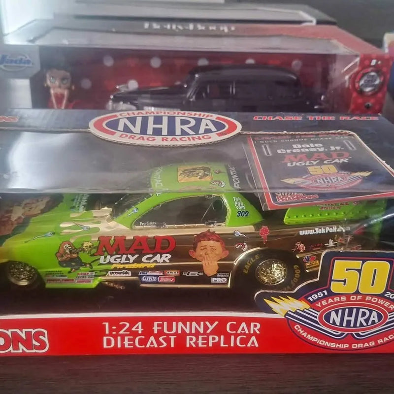 1:24 funny car diecast replica in retail box, red and green with NHRA logos