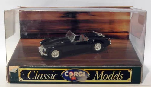 1/43 scale black open-top diecast sports car in display box