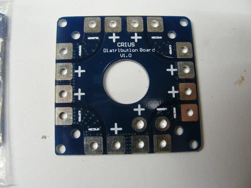 CRIUS power distribution board, blue PCB with plus terminals and mounting holes