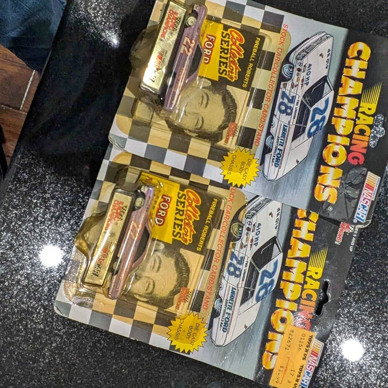 Diecast car models in blister packaging on checkered cards, Scottsdale AZ