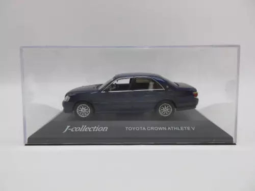 Diecast sedan car, dark blue, side view, in display box