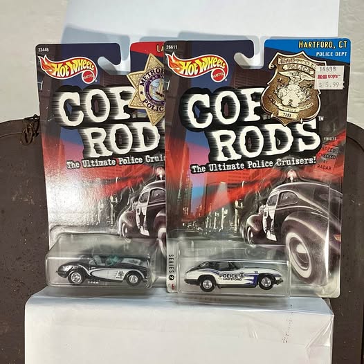 Hot Wheels diecast police cruiser cars in blister pack, front view