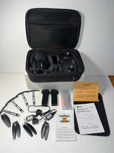 Drone carrying case with controller, batteries, cables, and spare propellers