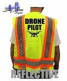 Hi-visibility safety vest with orange reflective stripes and 'DRONE PILOT' print