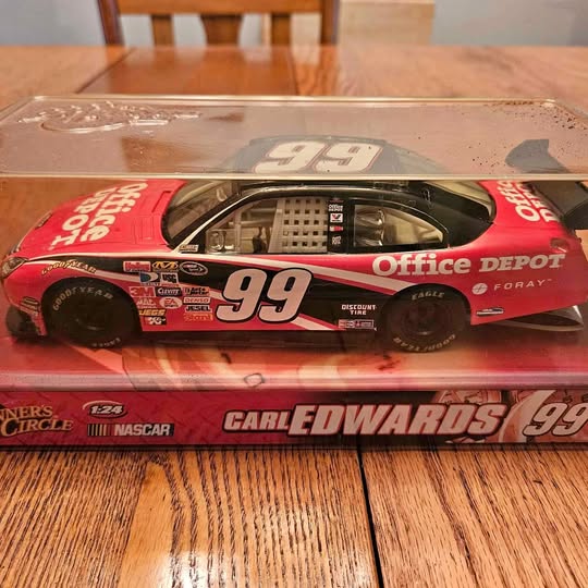 Red diecast race car model with large 99 and Office Depot branding, 1:24 scale