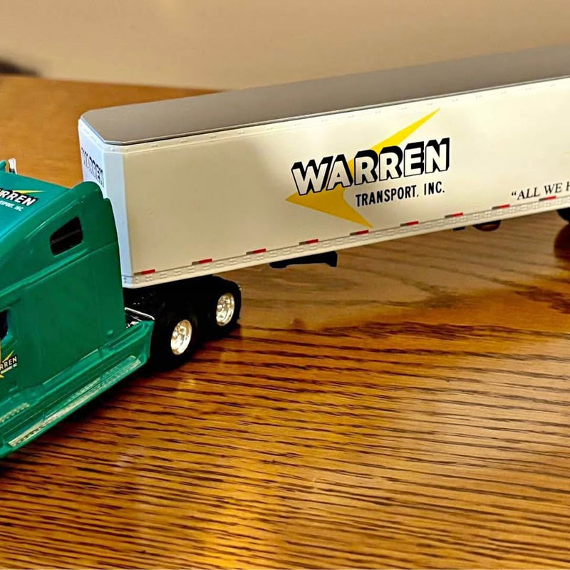 Diecast tractor trailer replica with green tractor and white Warren Transport Inc trailer