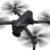 Black quadcopter drone with 4 propellers and front camera gimbal