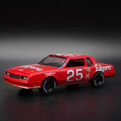 Red NASCAR diecast model car with #25 Folgers livery, front three-quarter view