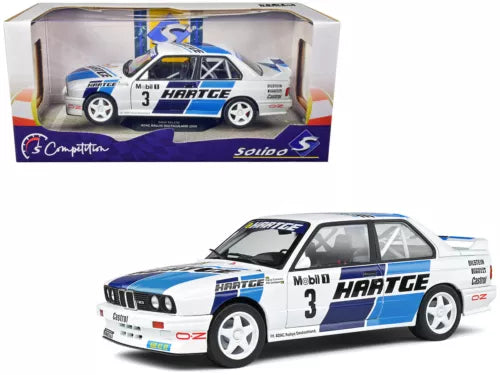 Rally diecast model car, blue and white BMW E30 M3 with #3 Hartege livery