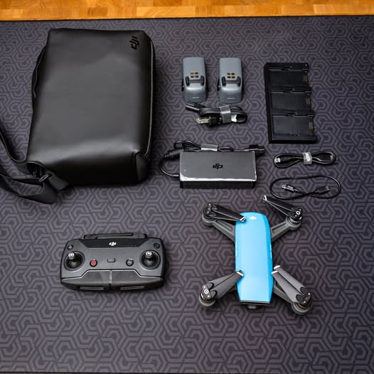 Drone and controller set with carrying bag, extra batteries and charging cables