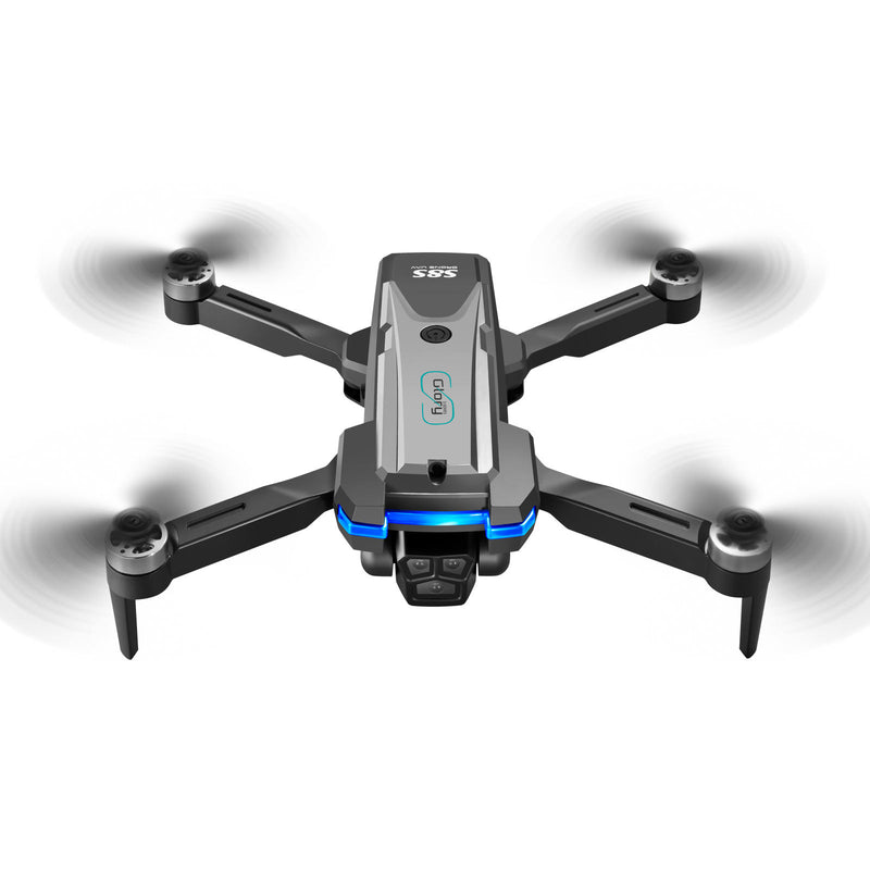 Small gray quadcopter drone with camera, four propellers and blue LED lights