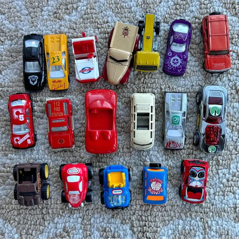 Diecast toy car assortment with multiple vehicles, red, blue, yellow, black, and purple bodies