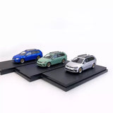 Diecast 1:64 model car set with blue, green, and white wagon vehicles on stands