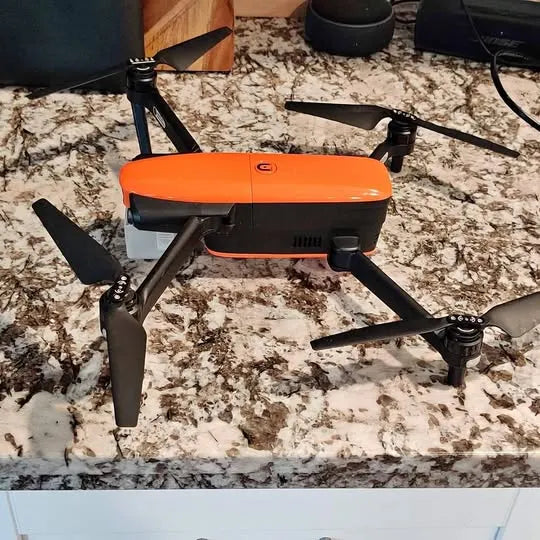 Autel Evo quadcopter drone with orange control module and four arms, front view
