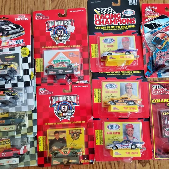 Lot of 13 1:64 diecast racecars in original blister-card packaging