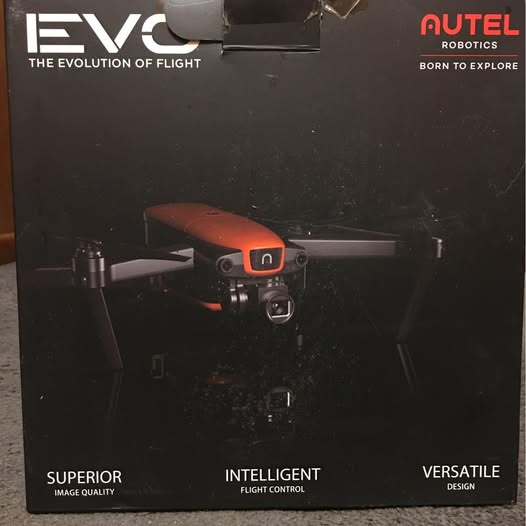 Quadcopter drone with camera, shown in retail packaging