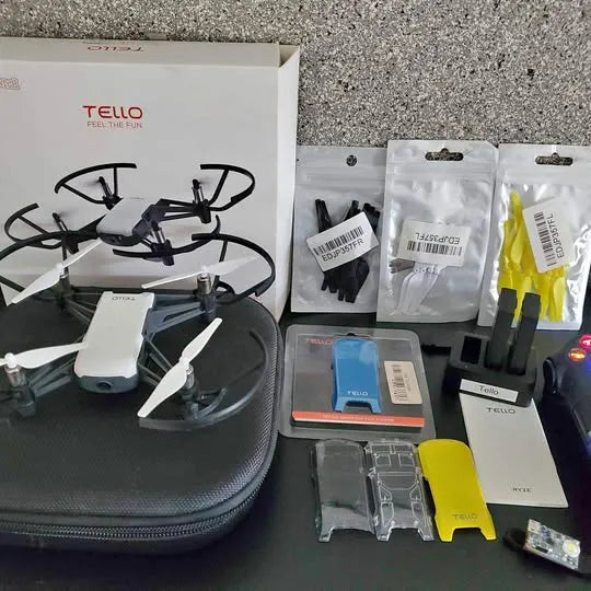 Tello drone kit with carry case, drone, propellers, and spare accessory parts