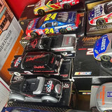 Set of NASCAR 1/24 diecast race cars in blister packaging, multicolor